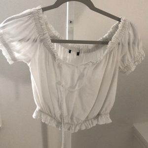 white cropped off the shoulder shirt